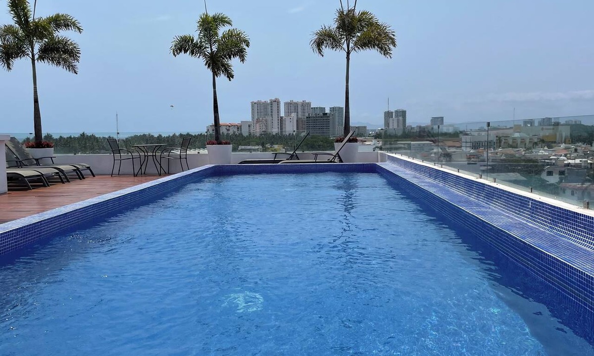 Diaz Ordaz Condo | 1 BR w KING Bed Rooftop Pool Walk to BEACH Prime Location