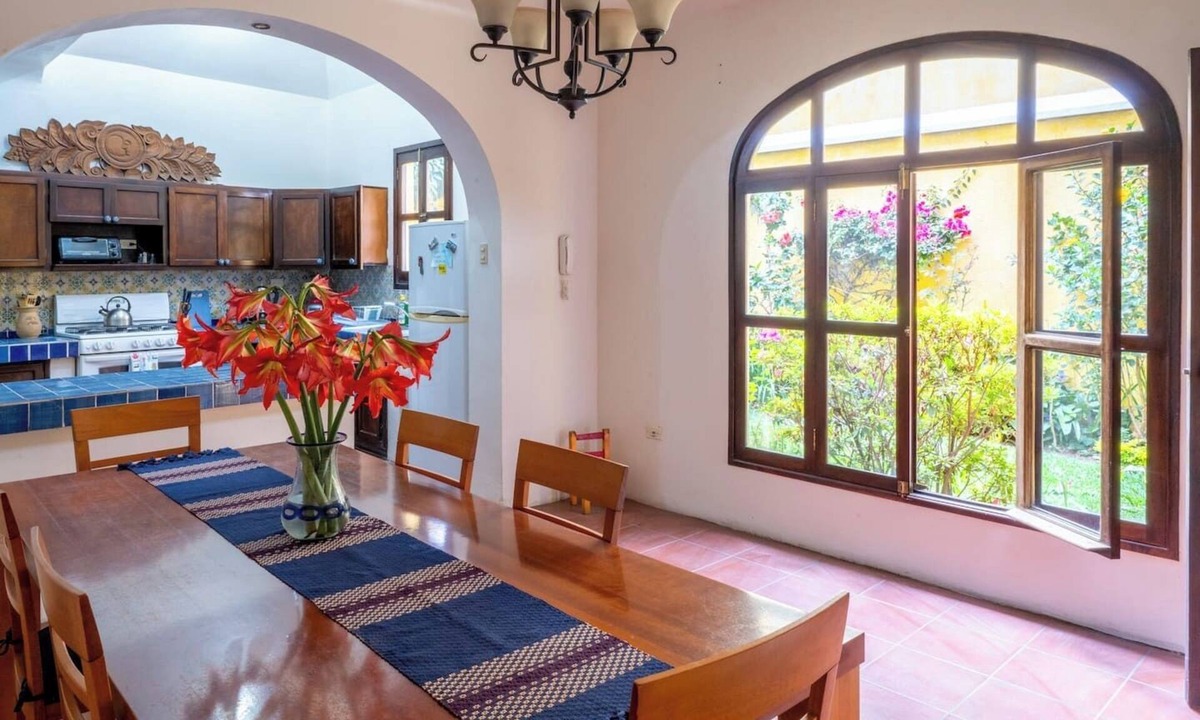 Antigua Guatemala House | Charming 3-bedroom family home in a secure, gated Antigua community. Enjoy a lush garden, volcano views from the terrace, and a spacious kitchen. Fully equipped for a comfortable stay, this peaceful retreat is just a 15-min walk from Central Park.