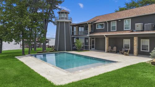 Onalaska House | Huge lakefront retreat with private pier, pool, game room and outdoor fire pit