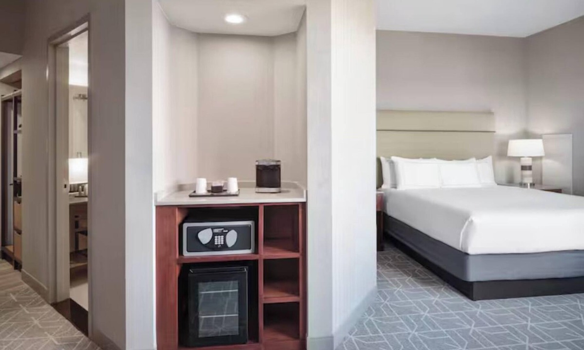 Richardson Hotel | Sip, Splash & Shuffleboard Fun: Your Perfect Poolside Retreat with Free Shuttle