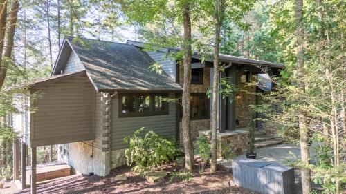 Cherry Log House | A Stoney River - Cherry Log, GA - Enjoy Scenic River Views, Soak in the Hot Tub, Challenge Friends in the Arcade, and Rack Up a