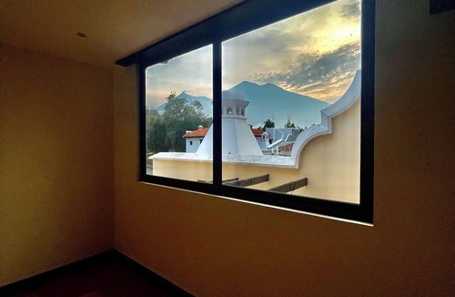 Ciudad Vieja House | Antigua Luxury Stay with Jacuzzi. Roof top fire pit and those volcano views!