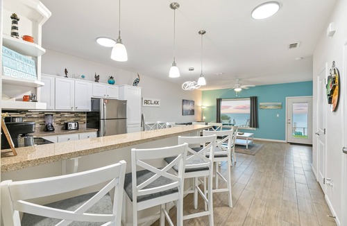 Port Isabel House | Bayfront Home with Shared Pool, Dock, Balcony, Playground and Washer/Dryer