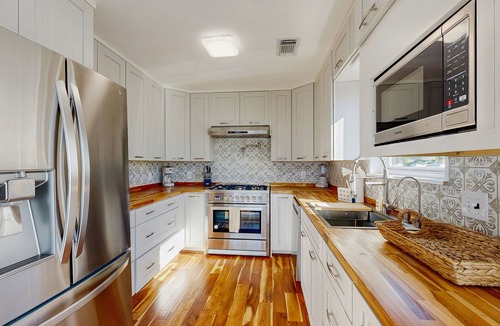 La Marque House | Beach house with private ping-pong and foosball table, patio and water view