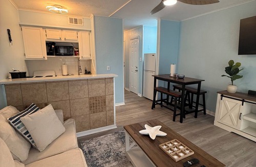North Beach Condo | Beachside escape at Villa Del Sol—steps away to sand, pool, Aquarium & USS Lex.