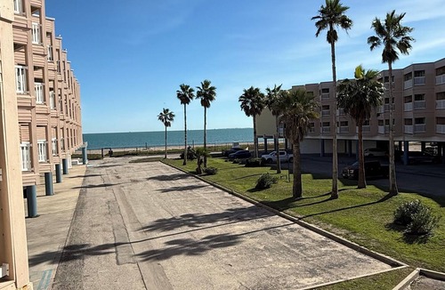 North Beach Condo | Beachside escape at Villa Del Sol—steps away to sand, pool, Aquarium & USS Lex.