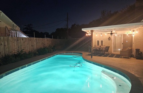 Haltom City House | Central DFW location with cozy fireplace and pool.