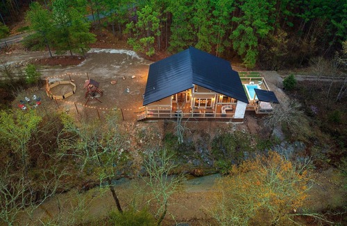 Broken Bow Cabin | Charming Creekside Escape: Pool, Putt-Putt, Game Room & Pet Friendly