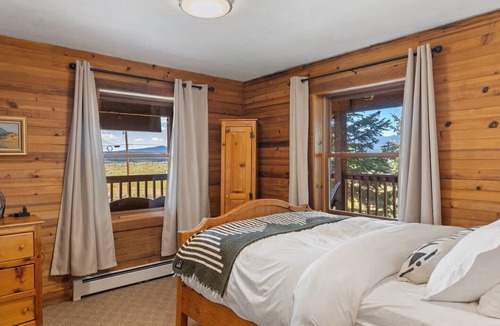 Clark Cabin | Comfortable private queen room in the True North Adventure Lodge. Includes a queen bed, private ensuite bathroom, and access to shared amenities like the kitchen, great room, and hot tub. Great for couples or solo travelers.