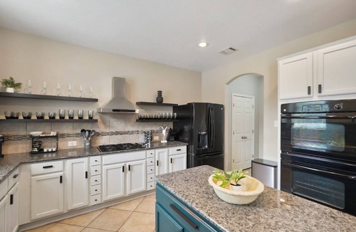 Pflugerville Apartment | Cozy 5BR Getaway Pool Games Sleeps 18