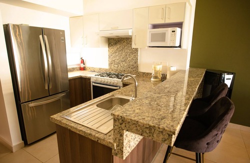 Zona Industrial Condo | Cozy, elegant 2BR steps to US Consulate