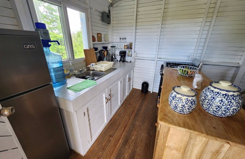 Rio Dulce Cabin | Cute & Cozy Caribbean Cabin on a farm.