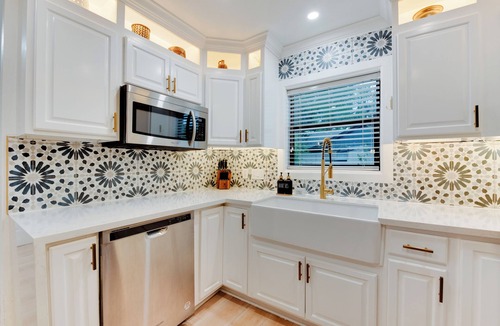 Spring Branch Central House | Durango is a centrally located Spring Branch home near Memorial City Mall, with quick access to Buffalo Bayou Park and The Galleria for outdoor fun, shopping, and dining. Enjoy a fully fenced outdoor retreat with a patio swing + fire pit, and foosbal
