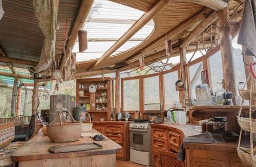Pasajcap House | Earthship 3-level apt., portside, connected to an outdoor kitchen with a view.