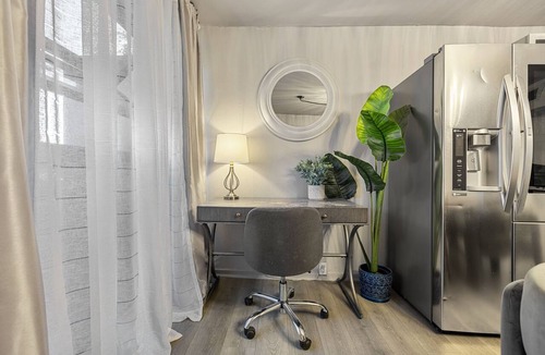Old East Dallas Condo | Experience elevated living in this executive 2-bed, 1.5-bath furnished condo featuring a private garden-view patio. Enjoy resort-style amenities including a pool, sauna, cold plunge, and outdoor fitness deck. Perfect for extended stays!