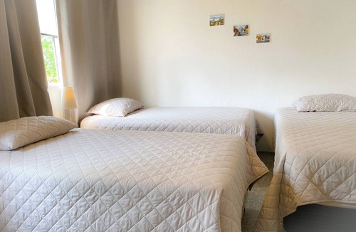 Zona 12 Hotel | Family room with air conditioning. Near Guatemala airport, zone 12.