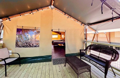 Prairie Lea RV Rental | Fully-Equipped Riverside Glamping Safari Tent on the San Marcos River, Texas