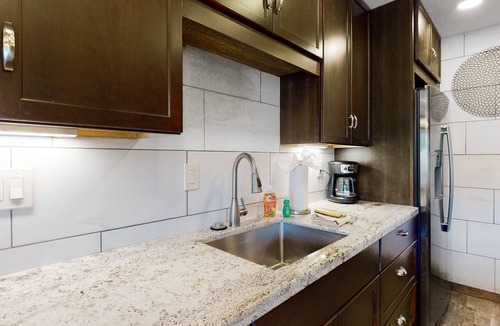 Carefree Condo | Ground-floor condo with on-site pool, grills, patio, & central AC