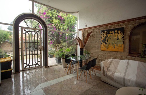 Cholula House | House with garden in front of the Pyramid of Cholula, Puebla,MX
