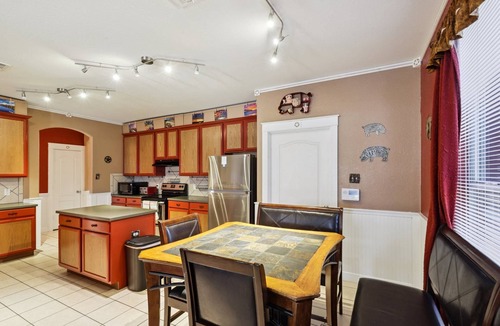 Hutto House | Huge Handicap Accessible Home Sleeps 21. Game Room, Office, Stocked Kitchen with so many TVs