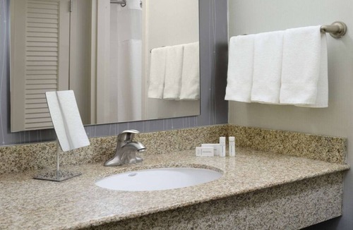 North Dallas Hotel | Indulge in Home-Like Comfort! Outdoor Pool, Pet-friendly and Parking!