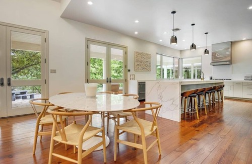 Hunt House | Inviting waterfront home with pool, patio, fireplace, W/D, & dog-friendly