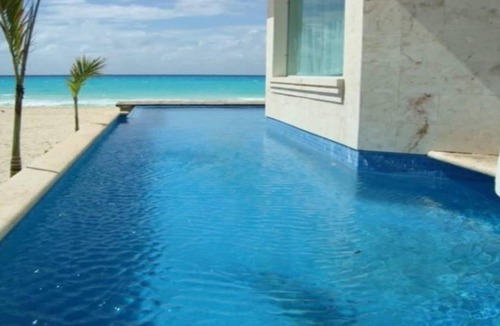 Playacar Fase I House | Luxury Beachfront Villa with a Pool & Deck in guard-gated Playacar