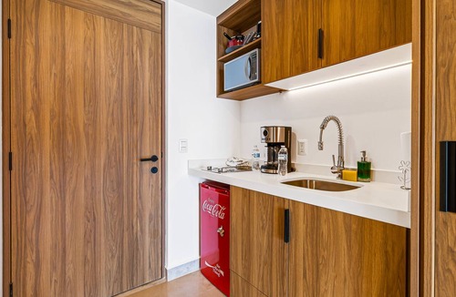 Las Glorias Apartment | Modern oceanfront studio with breathtaking sunsets, heated pools & beach access