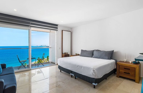 Las Glorias Apartment | Modern oceanfront studio with breathtaking sunsets, heated pools & beach access