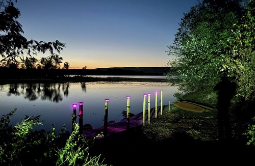 Waveland Cabin | Paradiso sunrise waterfront cabin sleeps 10 with large open room and AC, WiFi