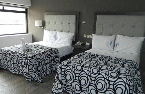 Centro Hotel | Relax in Two Bright Fun Rooms Close to Culture, Food, and Fun Spots