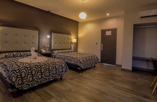 Centro Hotel | Relax in Two Bright Fun Rooms Close to Culture, Food, and Fun Spots