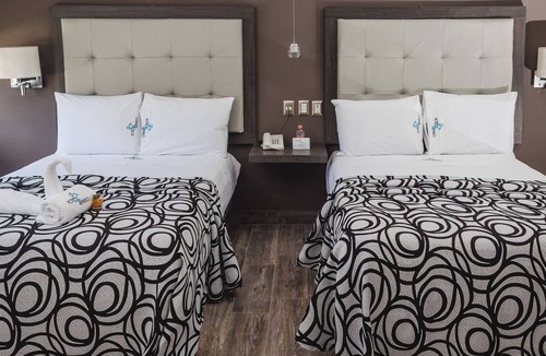 Centro Hotel | Relax in Two Bright Fun Rooms Close to Culture, Food, and Fun Spots