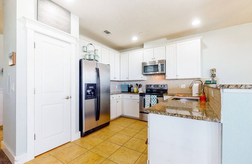 Red Fish Cove Condo | Serene waterfront condo with pool, hot tub, game room & washer/dryer