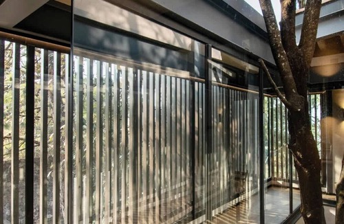 Valle de Bravo House | Stunning Glass House in Avandaro Forest w/ Hot Tub