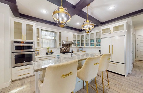 Port Isabel House | Stunning waterfront home with private pool, gym, & grill - steps to sand & SPI