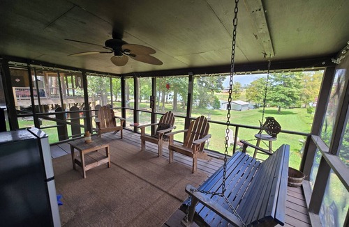 Negreet Cottage | Take a break and unwind on our waterfront screened in porch