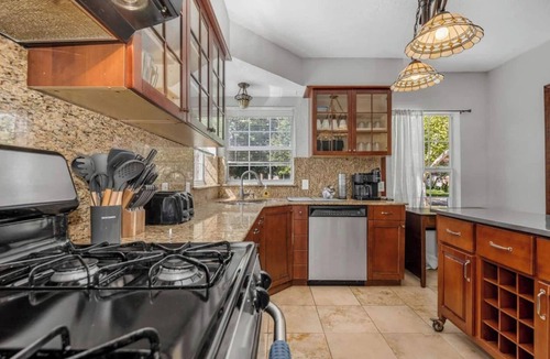 Oak Cliff House | The private home features two master suites with King beds and full attached bathrooms. The loft is 3rd private getaway with a Queen bed and attached full bath. Fully stocked kitchen and a separate Oak dining area.