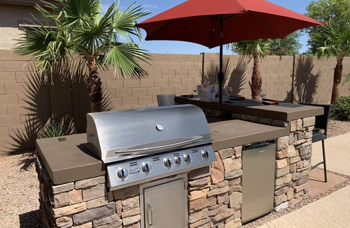 Estrella Mountain Ranch House | Tranquil Backyard with Pool/Spa, BBQ, and Putting Green.