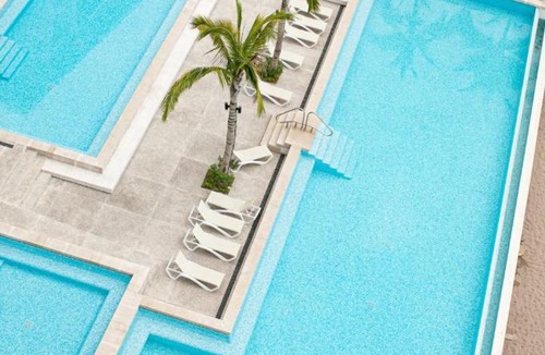 Las Glorias Apartment | Wake Up to Paradise – Stunning 2BR Condo Right on the Beach