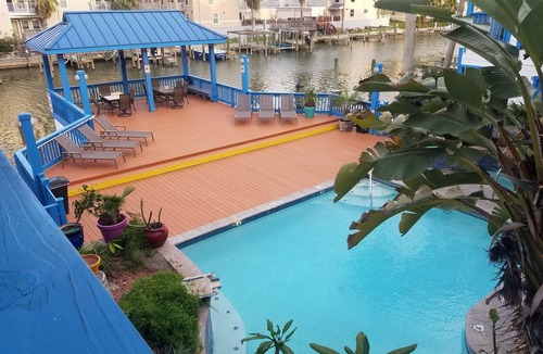 Corpus Christi Condo | Waterfront Paradise has a Reserved Boat Slip, Overlooks the Pool & the Canal