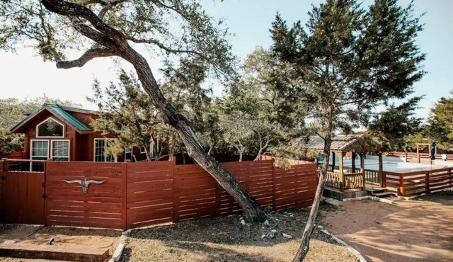 2 cabins across from each other and a shared pool!