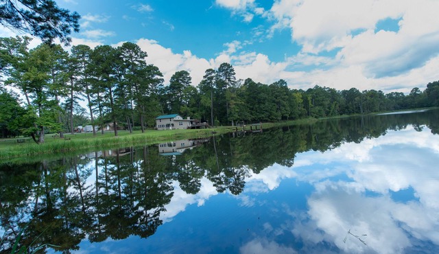 391-acre ranch home with private lake, pier, amazing views & game room