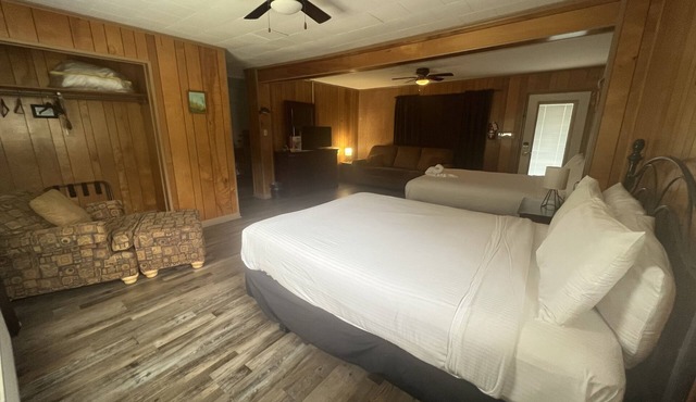 Budget friendly queen studio with full kitchen, two queen beds and sleeper sofa by RedAwning