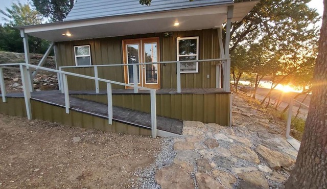 Charming Lakefront Cabin with Sandy Beach Access & Fire Pit Near Lake Cisco, TX