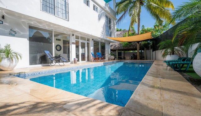 Family-sized entire house with private pool. 10 minutes to a black sand beach!