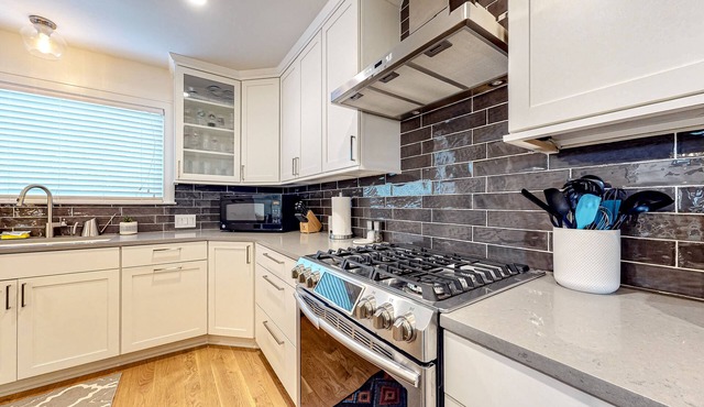 Home with central AC, W/D, grill, & outdoor dining - near bus & rail stops