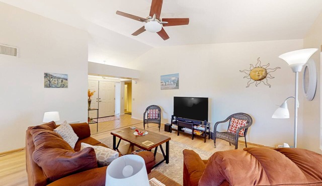 Mountain-view home with shaded patio, large yard, on-site golf & tennis