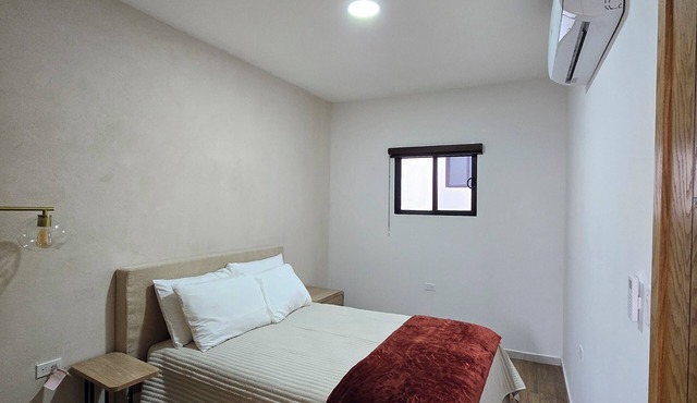 New centrally located apartment with shared balcony.