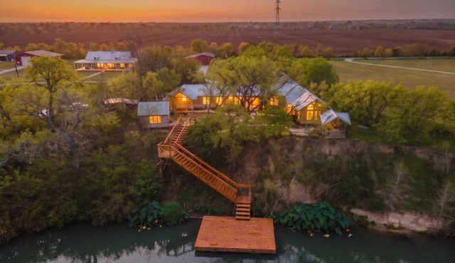 Private Riverfront Estate with Dock, Pool, Hot Tub, and Gym